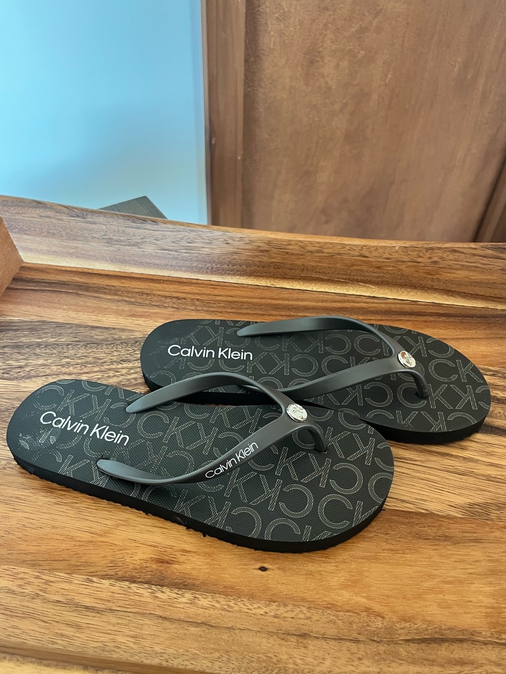 Calvin Klein Brown Logo Pattern Flip Flops